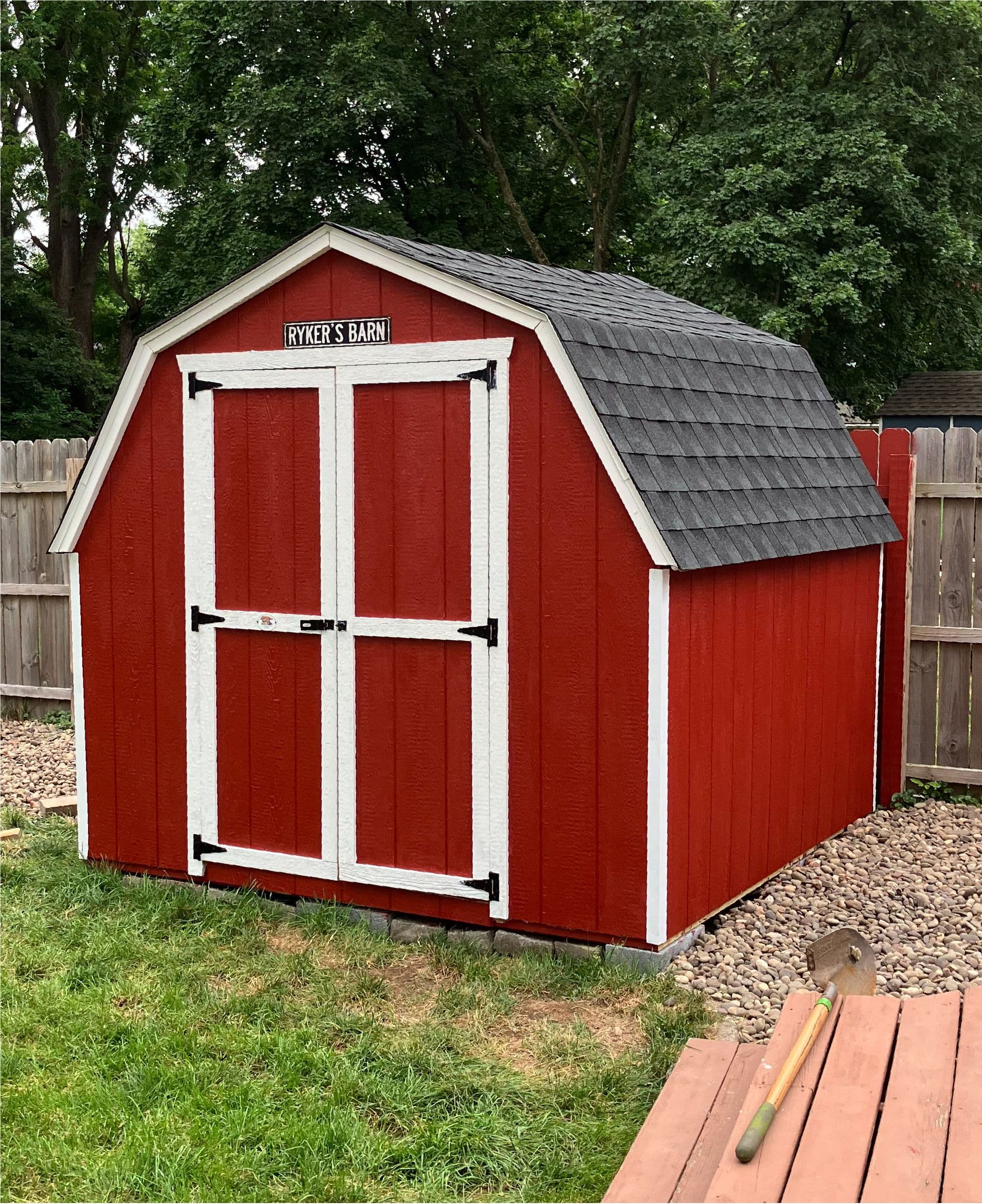 red shed in backyard near fence