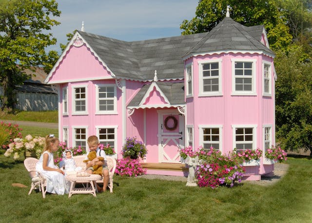 8x16 Sara's Victorian Mansion playhouse with kids playing outside