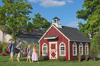 Stratford Schoolhouse with children wearing backpacks